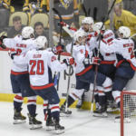 caps defeat pens